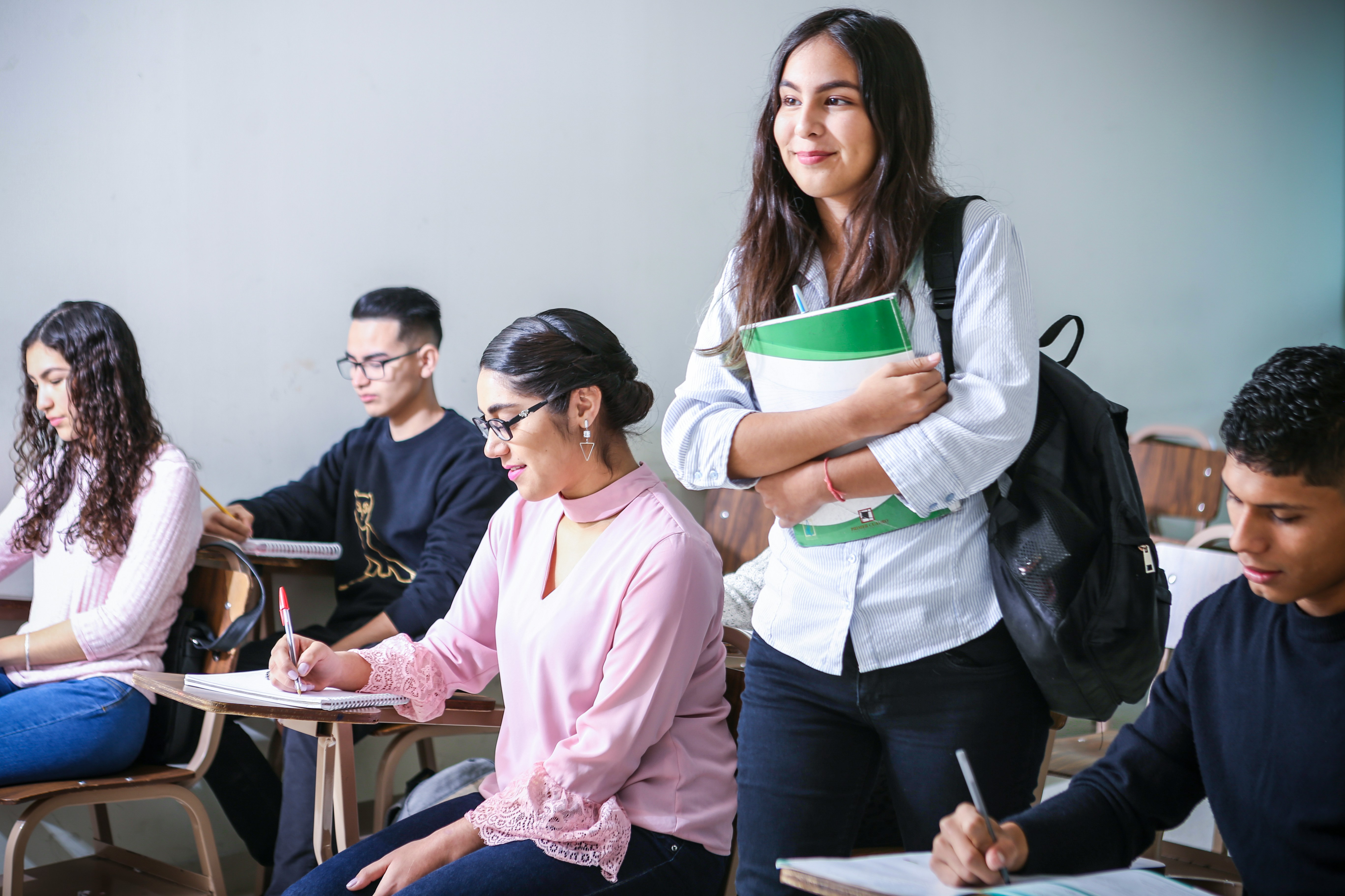 Further education students developing skills in a college classroom.